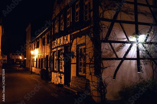 Old village Westerholt at night with street and traditional half-timbered houses in Herten  Germany