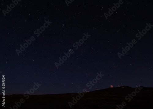 Night astrophotography  sky with stars at Roque de los Muchachos with telescopes of astronomical observatory  la Palma  Canary islands  Spain