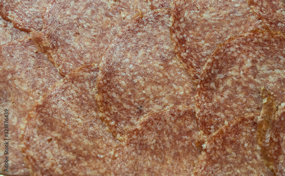 Slices of salami texture background Slices of salami texture background