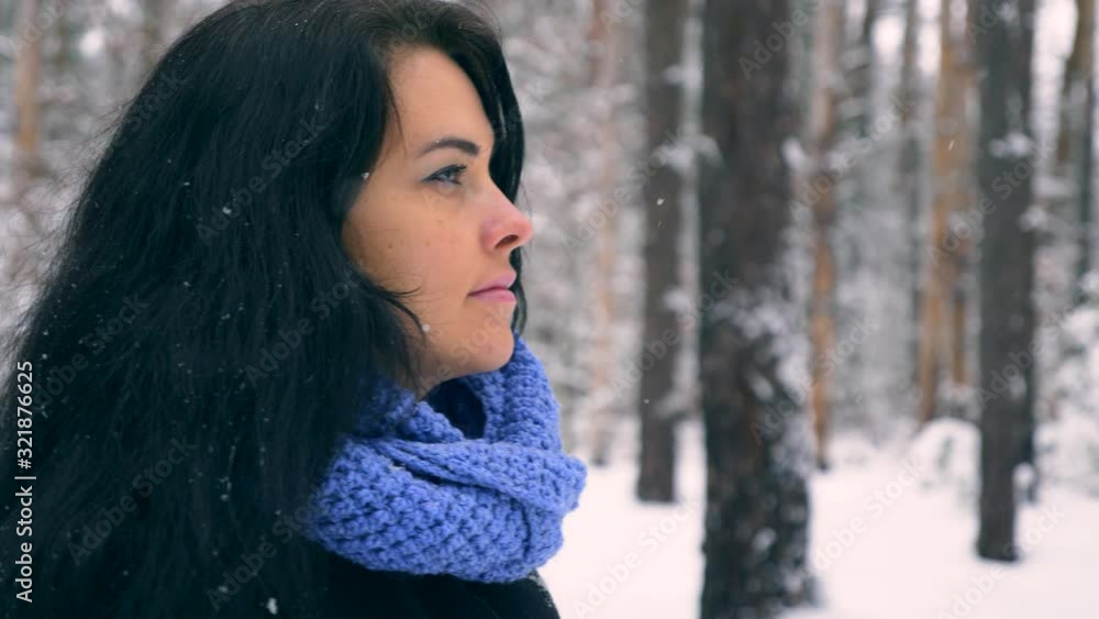 Serious Pretty Girl Walks Enjoying Nature In Winter Forest During Snowfall. Hiking Traveling on Winter Holidays. Frost Weather Snow Covered Trees In Wood. Slow motion 60 fps Serious Pretty Girl Walks Enjoying Nature In Winter Forest During Snowfall. Hiking Traveling on Winter Holidays. Frost Weather Snow Covered Trees In Wood. Slow motion 60 fps