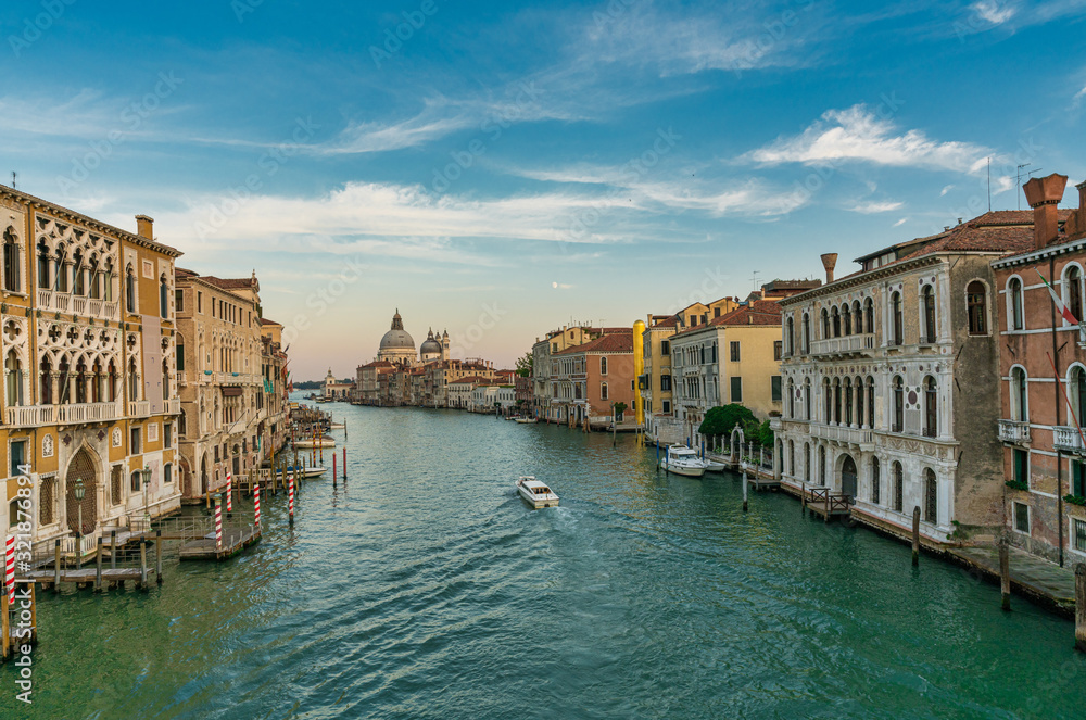Famous view of Basilica di Santa Maria della Salute and grand canal from Accademia Bridge, Venice, Italy.