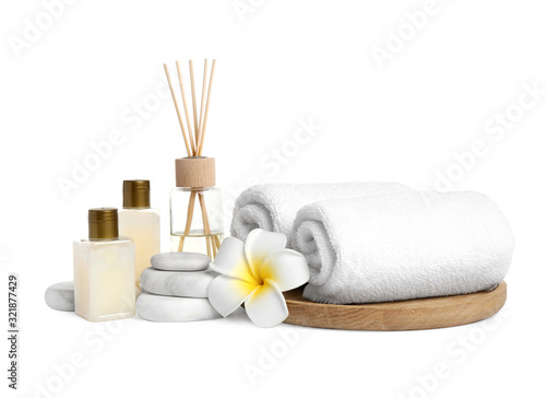 Beautiful spa composition with reed diffuser on white background