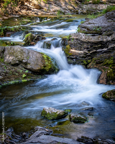 Fototapeta Naklejka Na Ścianę i Meble -  Mountain stream in motion blur