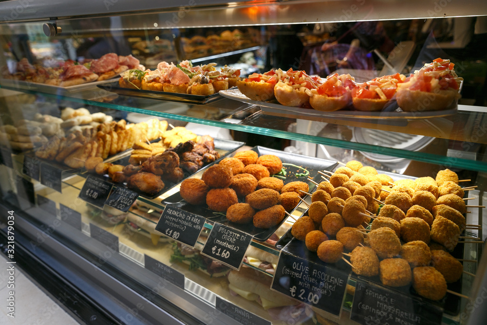 meat snacks, sandwiches on display in an Italian store or bar