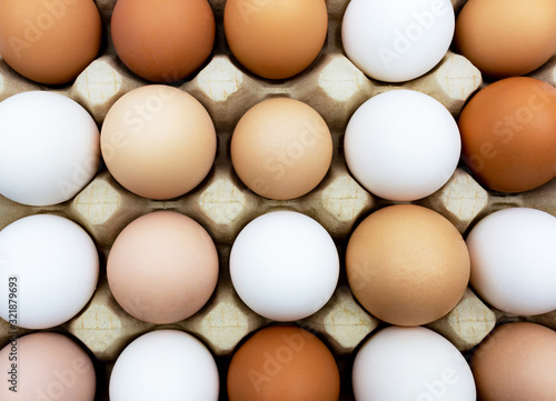 White, brown, gray chicken eggs close-up. Natural healthy nutrition all over the world. photo