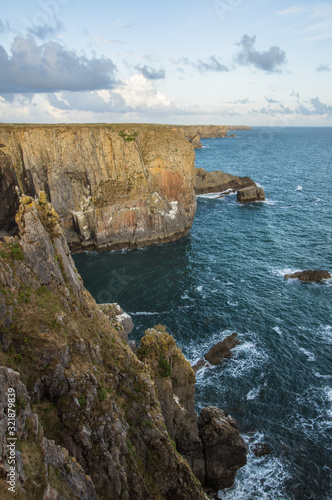 Rocky coast and blue sea in Pembrokeshire Coast National Park Wales United Kingdom UK