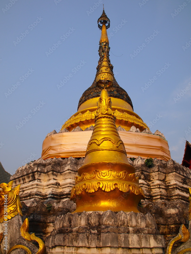 Fototapeta premium Temple in Chiangmai Thailand Beautifully decorated with wonderful colours statues of Buddha, Payanak, and Monks on walking street in the old city