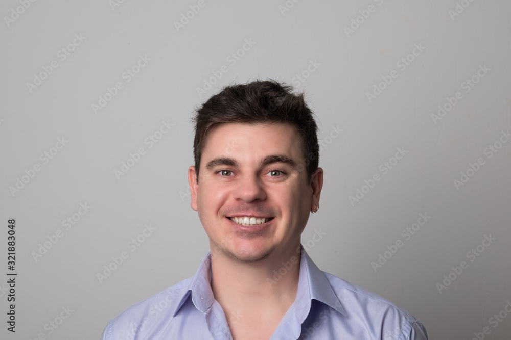 Positive young man. Studio image. The smiling man. Positive young man. Studio image. The smiling man.