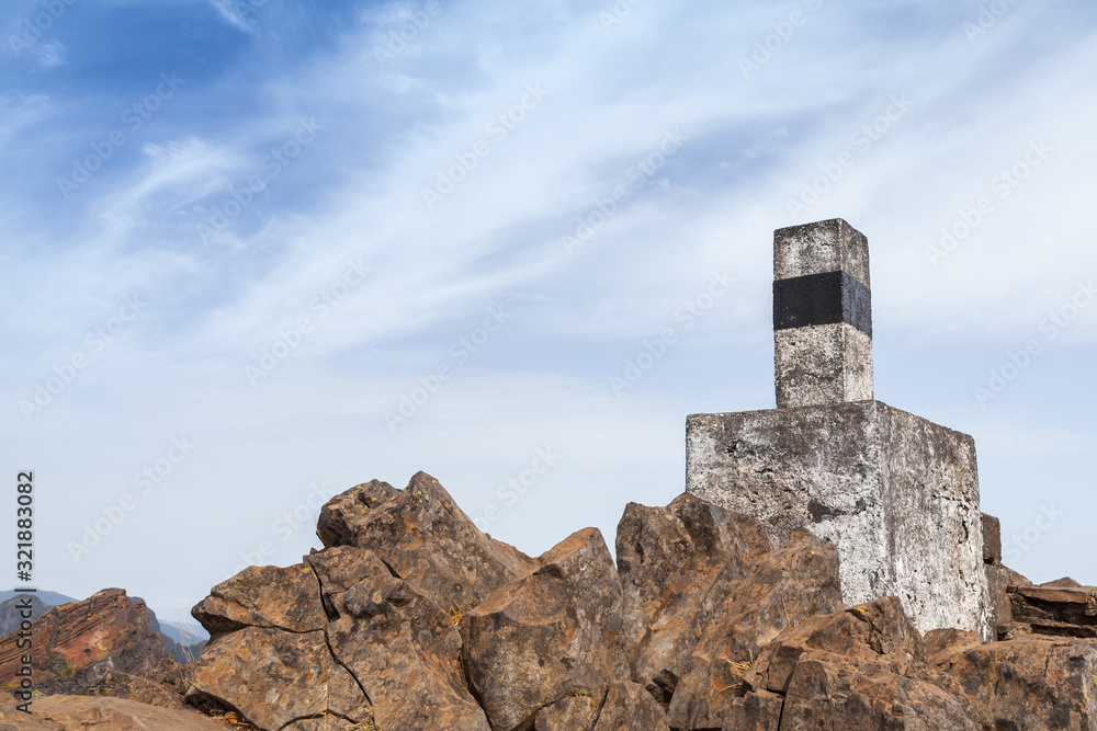 Stone geodesic landmark on the top of Pico do Arieiro Stone geodesic landmark on the top of Pico do Arieiro