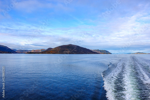 Boat trip through island and mountain landscapes in Norway