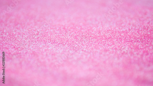Blur pink sparkle background. Defocused glitter texture