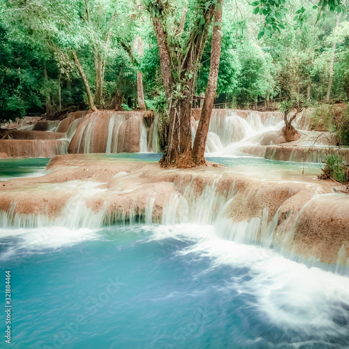 Fototapeta Naklejka Na Ścianę i Meble -  Jangle landscape with turquoise water of Kuang Si waterfall. Laos