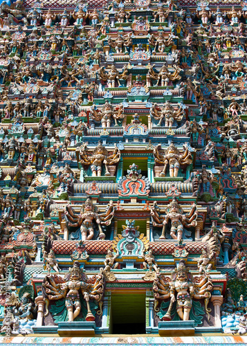 Great Indian architecture and religious art. Gods pantheon at Temple Gopuram (tower) facade Ancient colorful statues of Mahabharata Heroes South India © PerfectLazybones