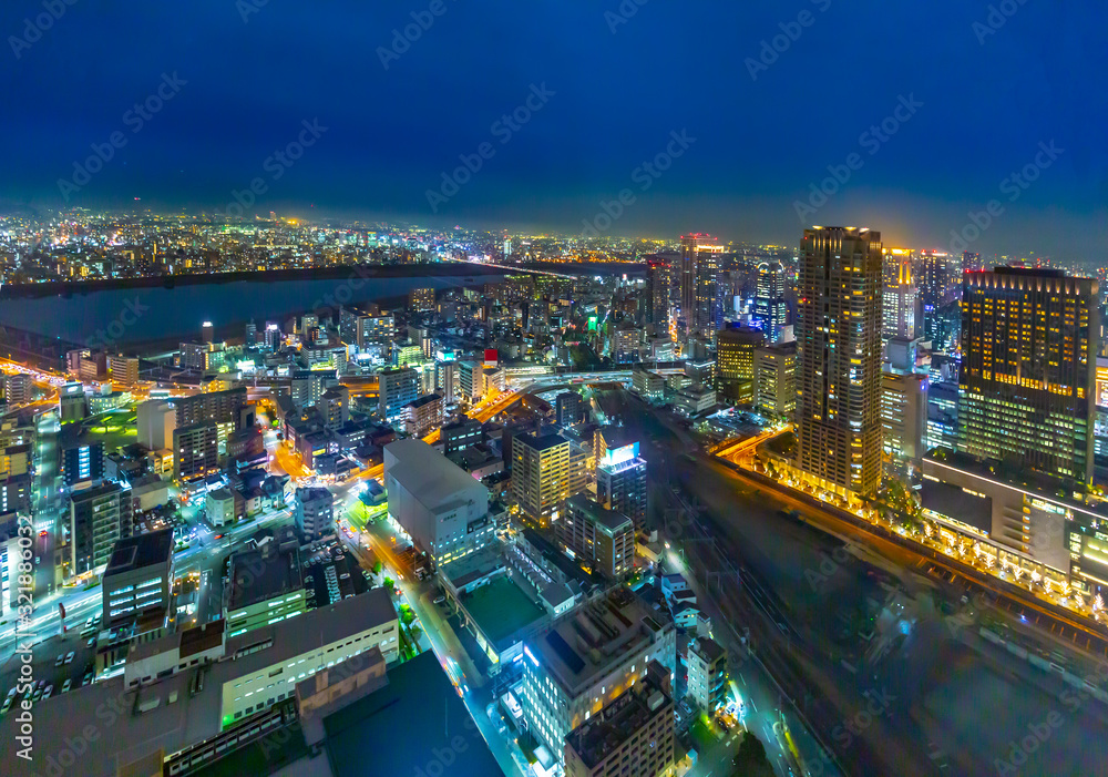Beautiful Osaka city aerial night light view with the river,  Japan