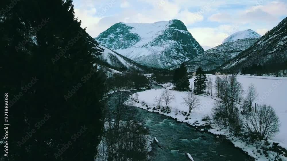 Flight over the river, in the winter scenery in the mountains, Valldal, More og Romsdal, Norway 2019, 4K Flight over the river, in the winter scenery in the mountains, Valldal, More og Romsdal, Norway 2019, 4K
