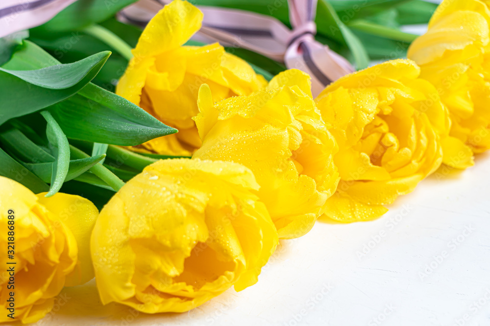 Bouquet of yellow tulips for the holidays. Women's Day, Valentine's Day, name day. On a white background. Bouquet of yellow tulips for the holidays. Women's Day, Valentine's Day, name day. On a white background.