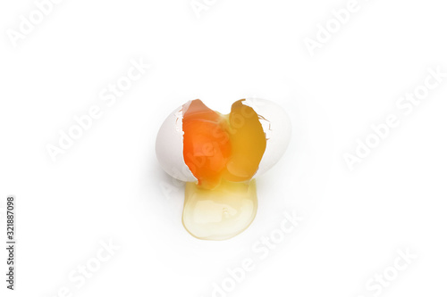 Canvastavla Broken chicken egg isolated on white background. Close up