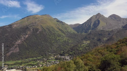 Drone flight with view of valley and the commune town of Villelongue, Pyrenees, France. photo