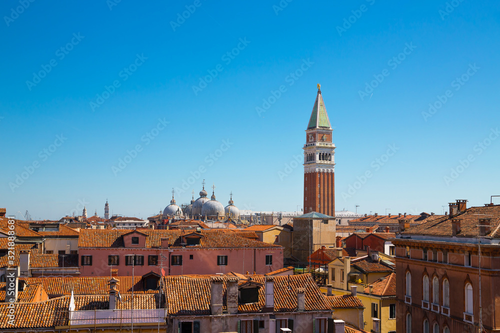 Panoramic view of the roof and the bell tower in San Marco in the distance.