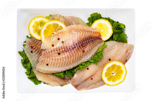 Whitefish Tilapia Fish Raw Fillet Isolated on White Background. Selective focus.