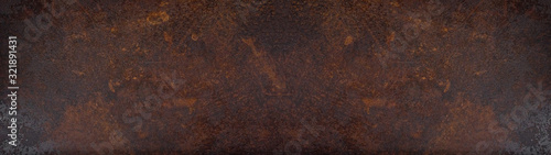 Rusty grunge dark metal corten steel wall texture background banner panorama