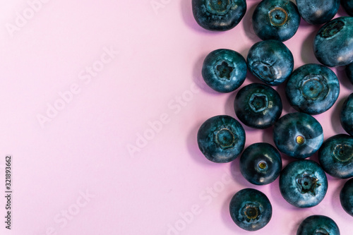 Blueberry on the pink background. Natural nutrition