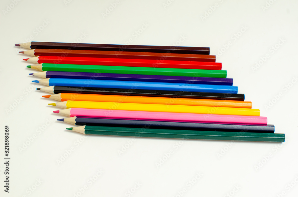 set of colored pencils on a white background set of colored pencils on a white background
