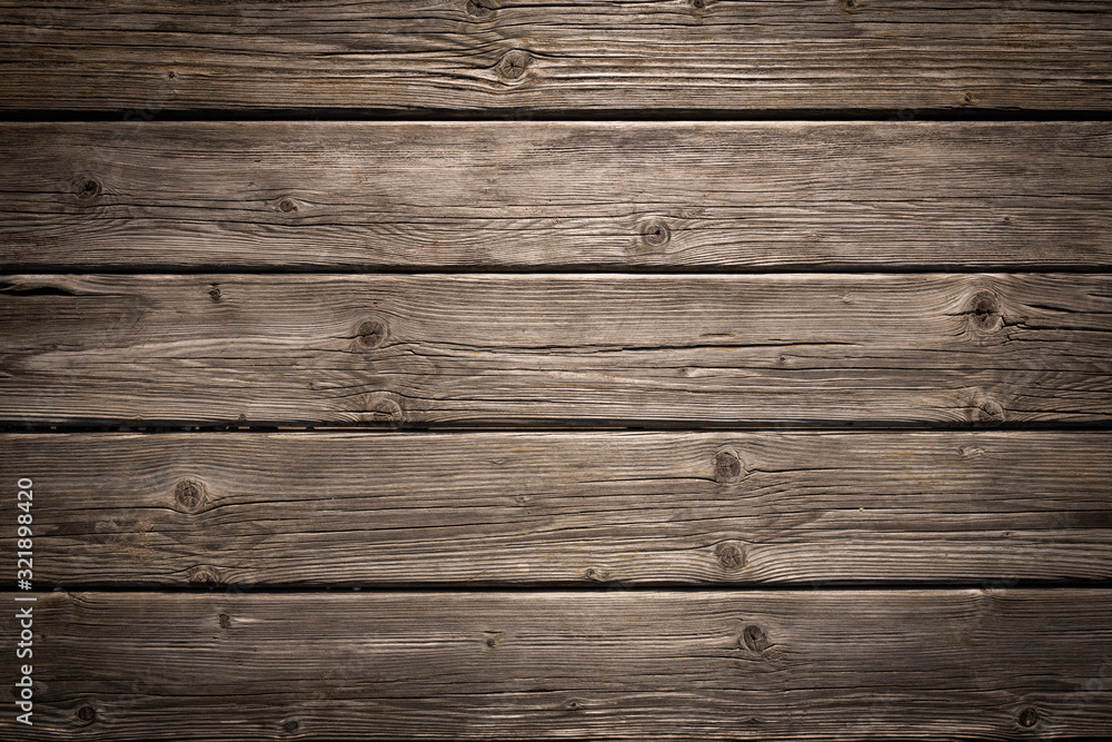 Dark wooden background texture. Old fence panels with natural patterns.