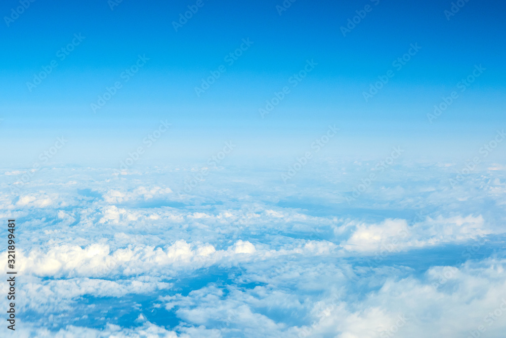 View over the clouds. Blue sky and clouds.