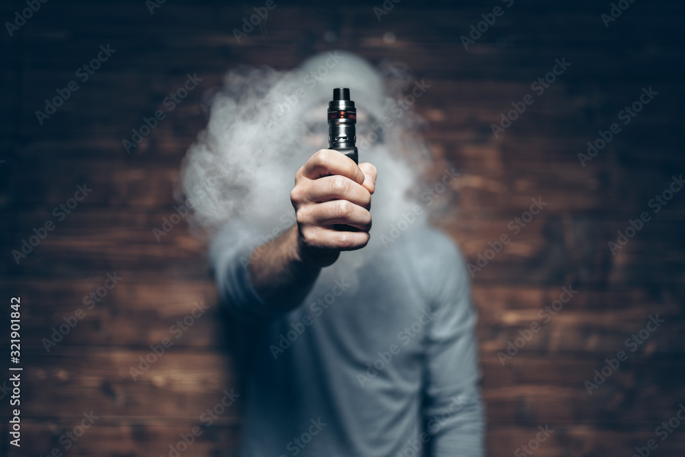 Vaping e-liquid from an electronic cigarette Vaping e-liquid from an electronic cigarette