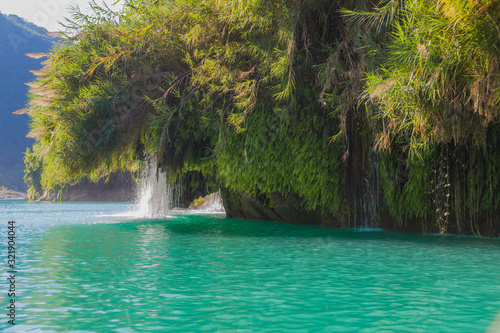 Amazing crystalline blue water of Tamul waterfall, Close up view of spectacular Tamul River,at Huasteca Potosina in San Luis Potosi, Mexico © @Nailotl
