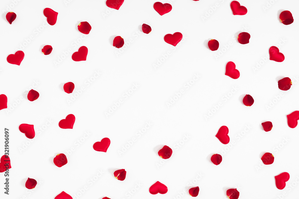 Elegant composition for Valentine's Day. Red hearts, rose petals on white background. Valentine day, 8th march, Mother day background. Love concept. Flat lay, top view, copy space
