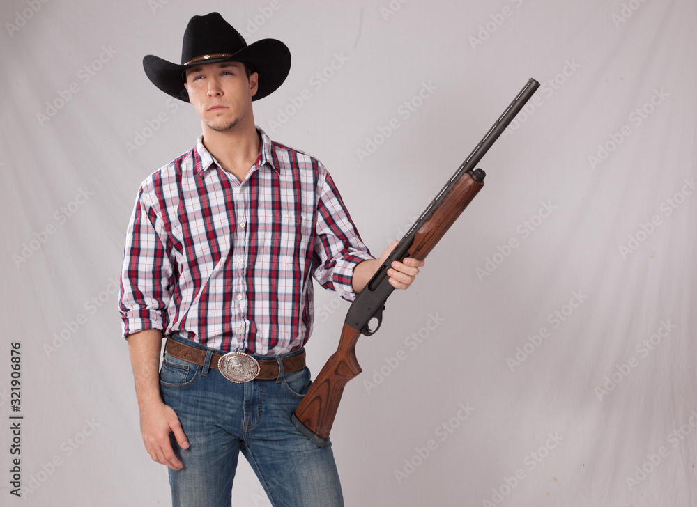 thoughtful Cowboy with a shotgun thoughtful Cowboy with a shotgun