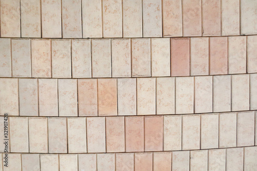 Texture of pink rectangular paving tiles covering.