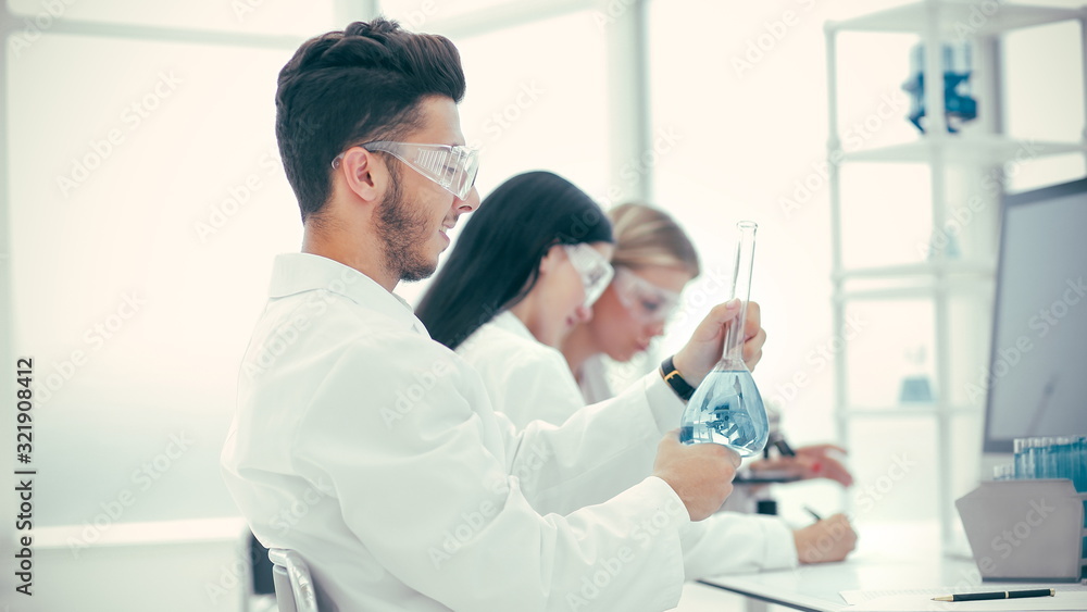 scientist and his assistants checking tests for coronavirus scientist and his assistants checking tests for coronavirus