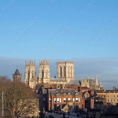 a view of york minster from the city walls with people and traffic crossing lendal bridge © Philip J Openshaw 