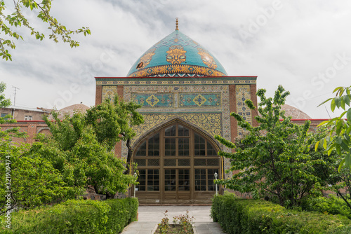 Blue Mosque in Yerevan framed by green bushes