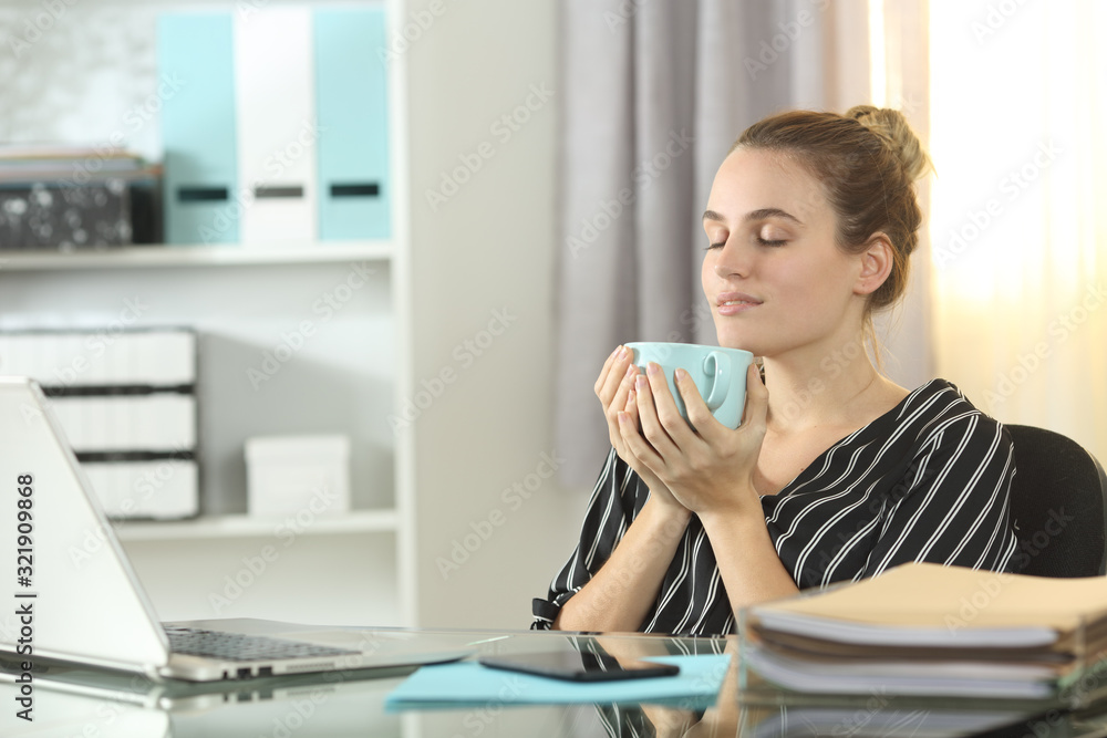 Entrepreneur resting drinking coffee at homeoffice Entrepreneur resting drinking coffee at homeoffice
