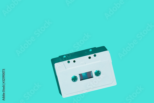 Audio cassette on colored background. Vintage audio cassette tape. Vintage disco poster.