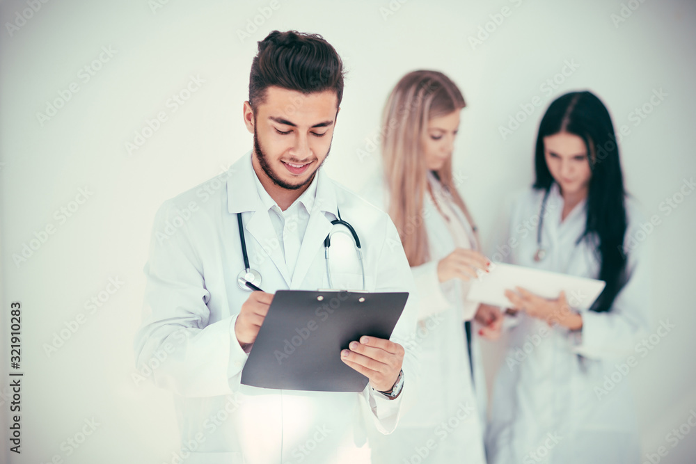 successful therapist on the background of his colleagues successful therapist on the background of his colleagues