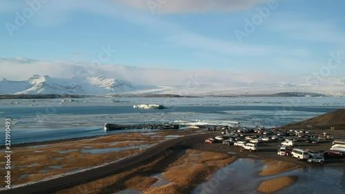 Aerial drone shot going down on Glacier Lagoon in Iceland