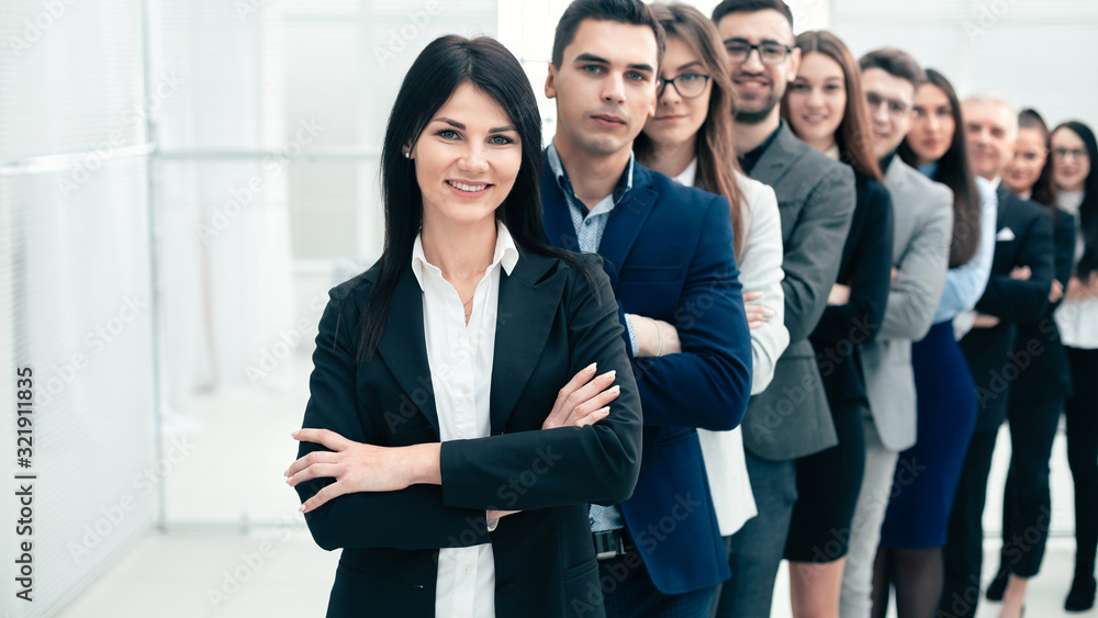 group of confident young people standing in a row group of confident young people standing in a row