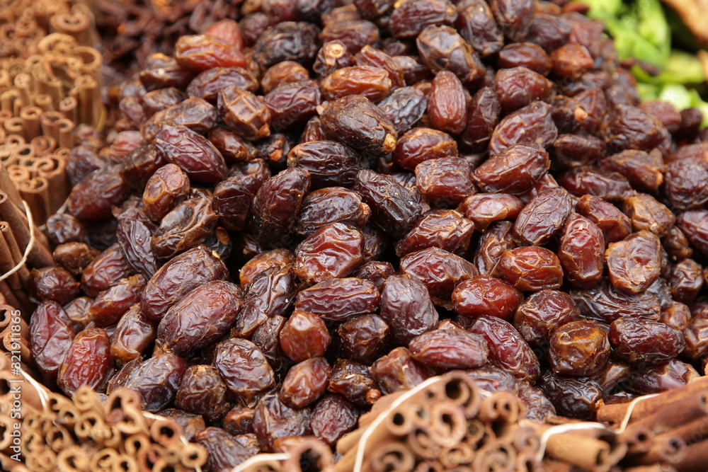 Pile of organic dates fruit close up Isolated. Dried fruit concept. Background, pattern, banner Pile of organic dates fruit close up Isolated. Dried fruit concept. Background, pattern, banner