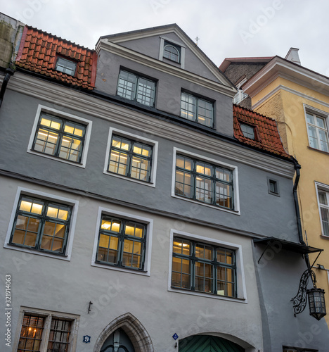 Tallinn, Estonia. Fragment of an old house on the town hall square. Evening photo
