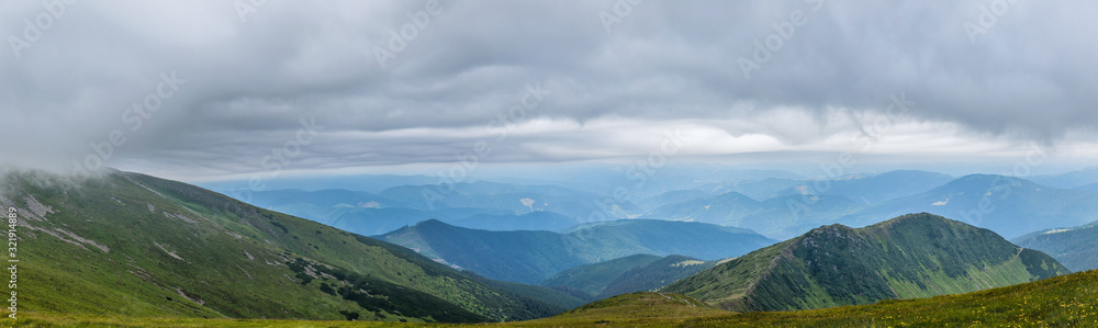 Panorama of beautiful, green mountains with clouds and forest. Ukraine, Carpathians. Panorama of beautiful, green mountains with clouds and forest. Ukraine, Carpathians.