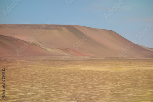 colorful dunes in Paracas National Reserve. Arid touristic zone in the coast of Ica/Peru.