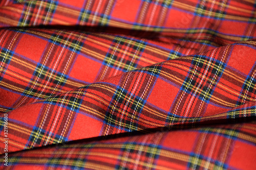 Red tartan fabric close up 