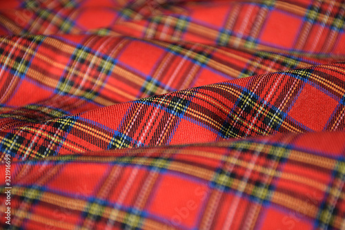 Red tartan fabric close up 