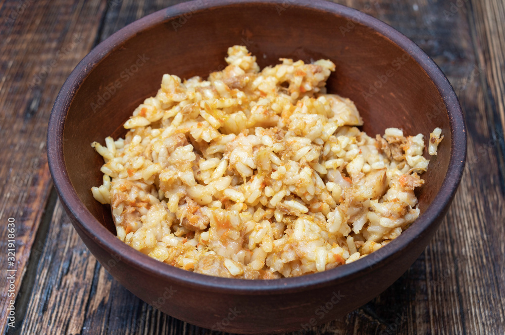 Pilaf with meat. Rice porridge with meat. Clay dishes. Pilaf with meat. Rice porridge with meat. Clay dishes.