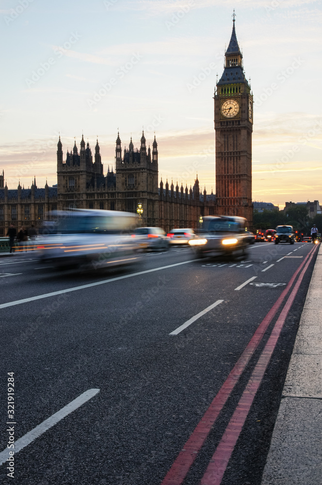 Cars passing by Big Ben in London England United Kingdom UK Cars passing by Big Ben in London England United Kingdom UK